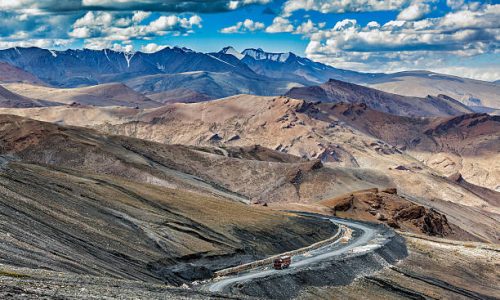 Indian lorry truck on road in Himalayas near Tanglang la Pass  - Himalayan mountain pass on the Leh-Manali highway. Ladakh, India
